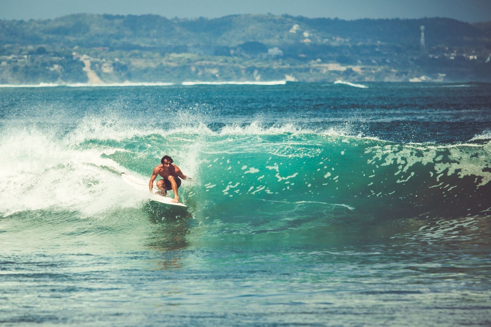 Surfer riding a wave on the Silver Coast