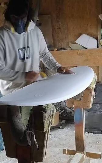 Luis Brito shaping a board in the workshop